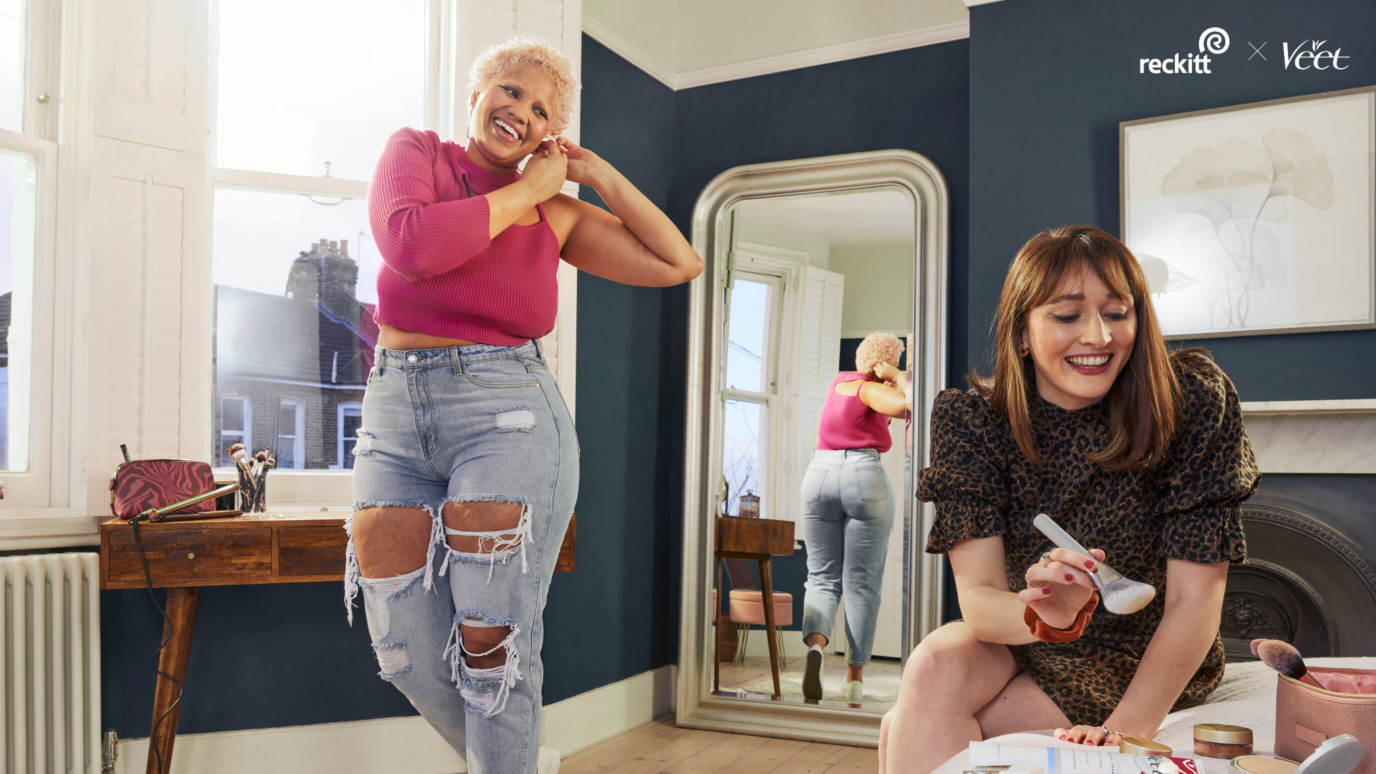 Reckitt- two women smiling getting ready in a room