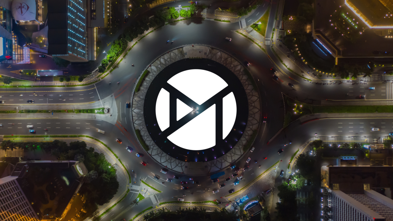 The Mobico Group logo over the top of a busy city roundabout