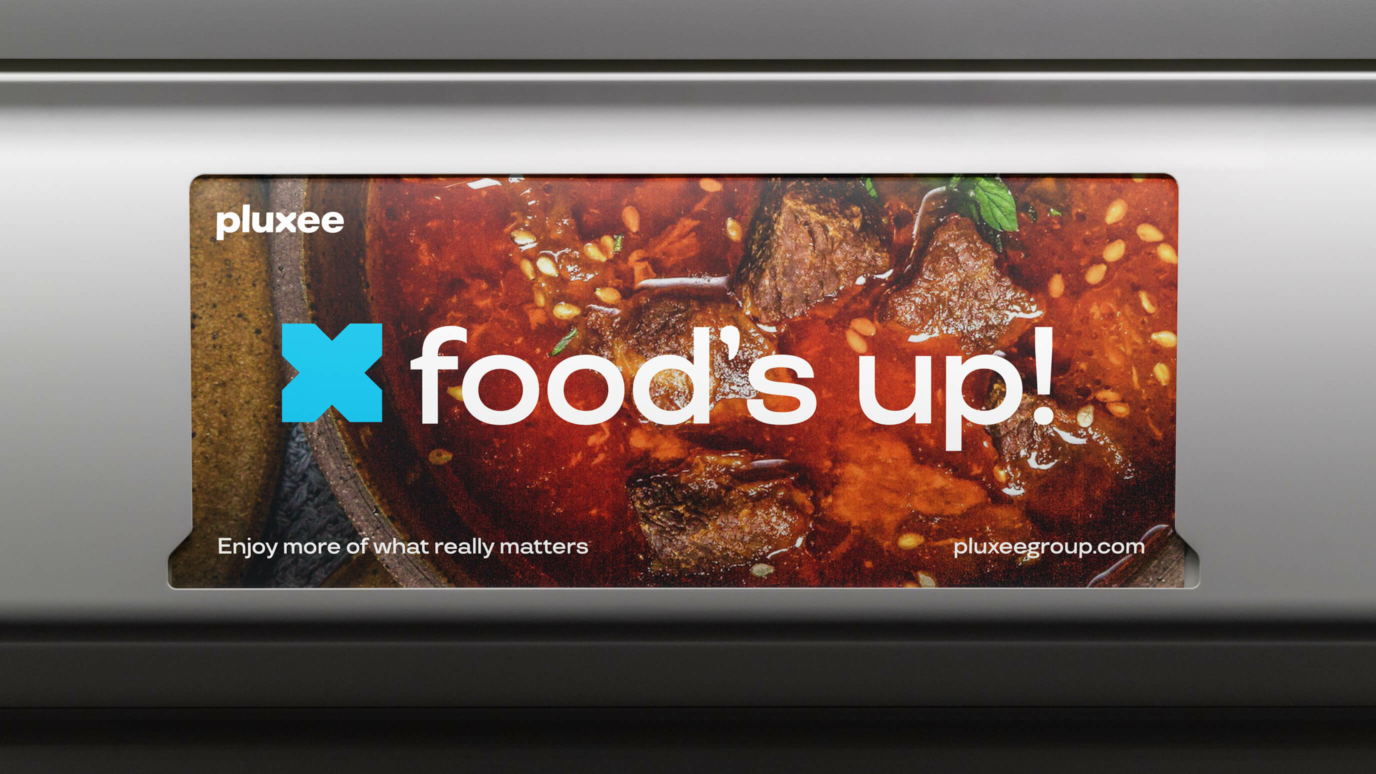Pluxee billboard saying food's up!