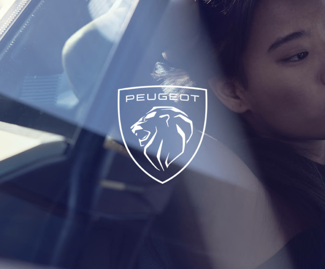 peugeot- a woman looking through the window