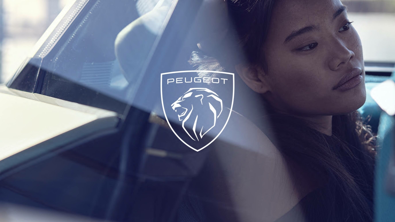 peugeot- a woman looking through the window