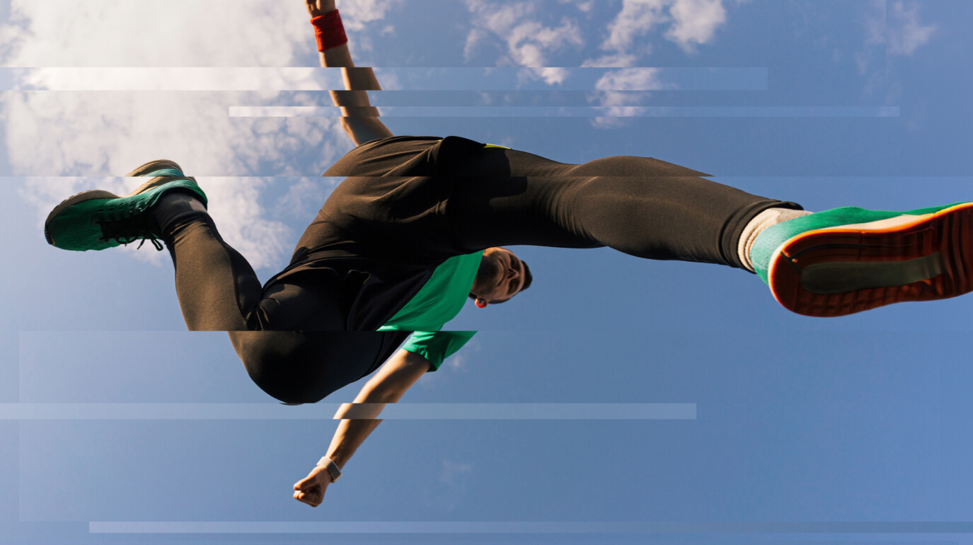 Person leaping over camera lens