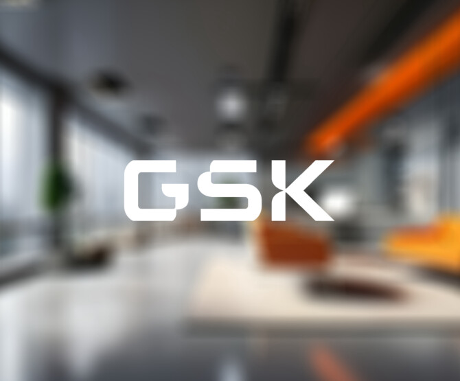 GSK logo over blurred office environment
