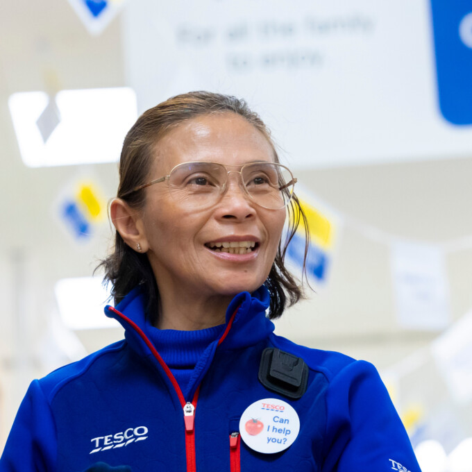 Smiling Tesco employee